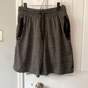 Russell Size Medium, Gray Athletic shorts. Zipper Pockets.